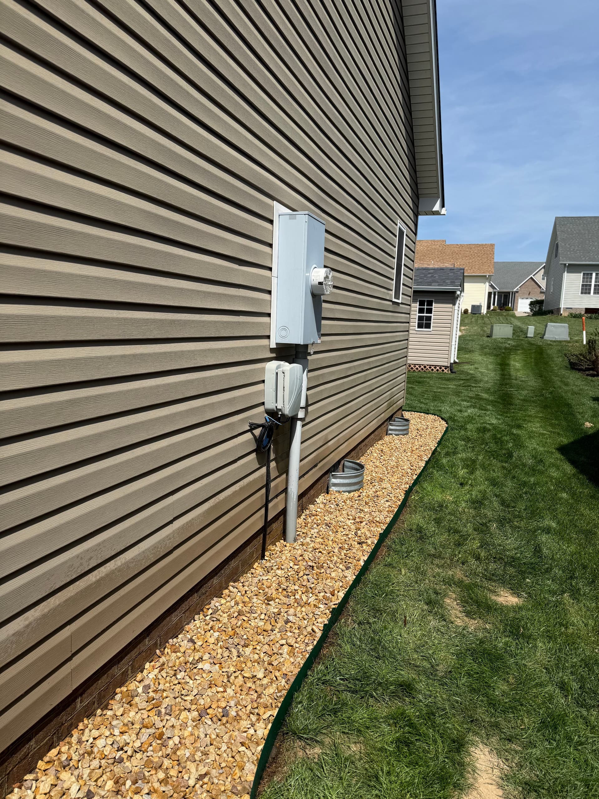 Rock Bed Installation Along House Foundation That Actually Works image