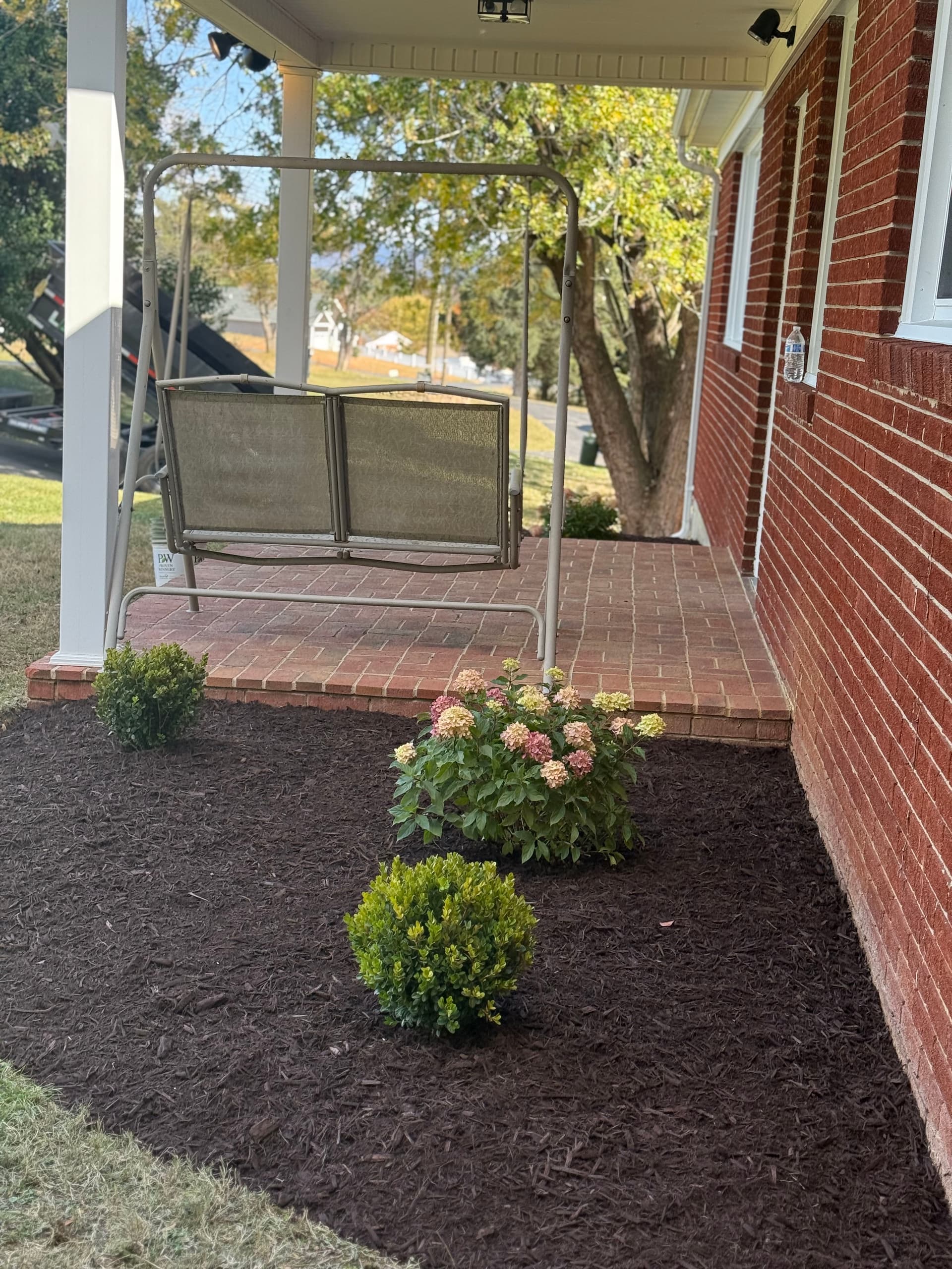 Gallery photos for Front Yard Makeover with Fresh Mulch and Vibrant Plants: Image #2